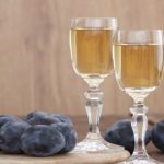 Plum brandy or schnapps with fresh and tasty plum